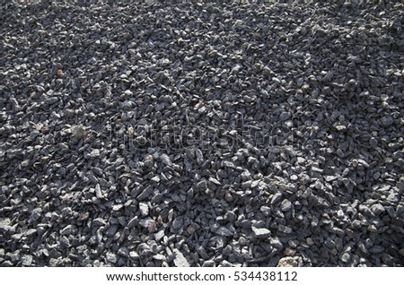 Close-up of gravel in parking lot