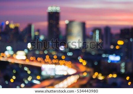 Abstract blurred lights city downtown and highway interchanged with dramatic sky background
