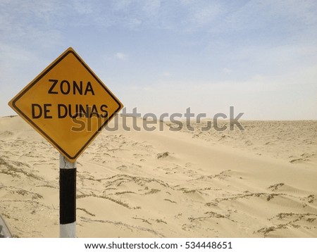 road sign warning of sand dunes in South America