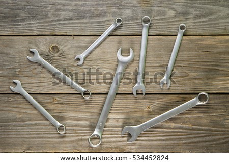 wrenches on a background of boards