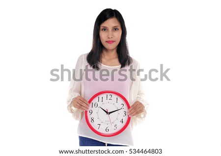 Beautiful young asian woman hold a clock isolated white background
