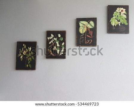 four tree pictures on the wall