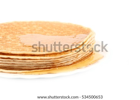 small stack of freshly baked ruddy delicious pancakes on a plate
