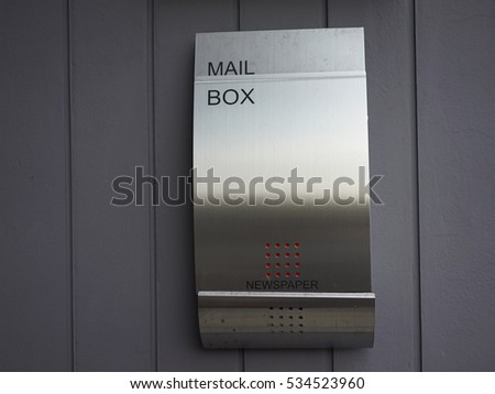 modern mailbox on the  dark gray concrete wall  