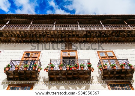 beautiful wooden old balconies with flower pots in La Orotava in Tenerife, Canary Islands, Spain Royalty-Free Stock Photo #534550567