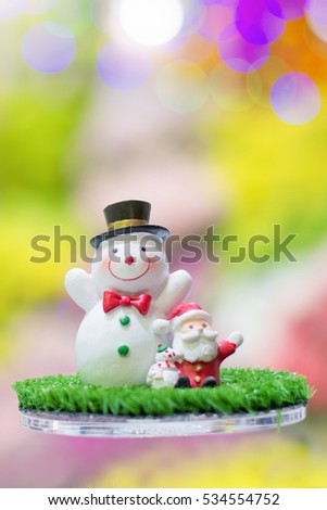 Snowman , Santa Claus and Christmas gift Signs of Christmas toy souvenir with colour of bokeh background.