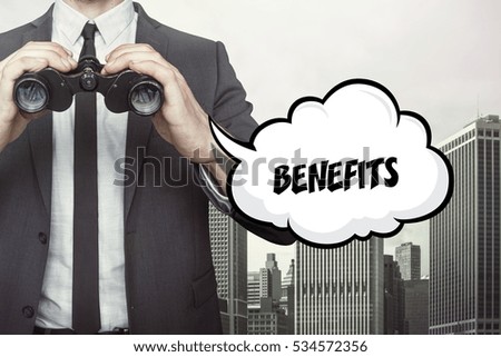 Benefits text on blackboard with businessman