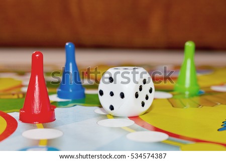 Different colors of Plastic chips with dice and Board game children . 