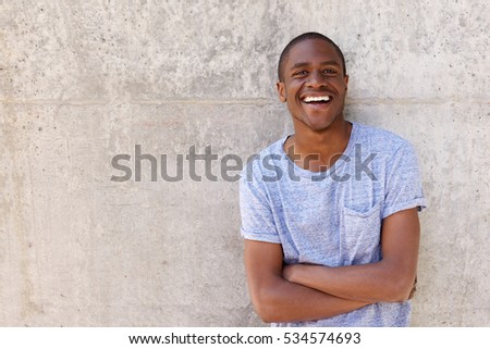 Close up portrait of a confident young black man smiling 