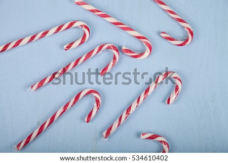 Ã�Â¡andy canes on a wooden background. Christmas sweets and decorations