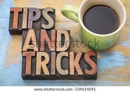 tips and tricks word abstract in letterpress wood type with a cup of coffee