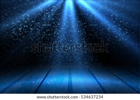 Stage light and blue glitter lights on floor. Abstract Christmas  festive background. Table for display your product. Spotlight realistic ray Royalty-Free Stock Photo #534637234