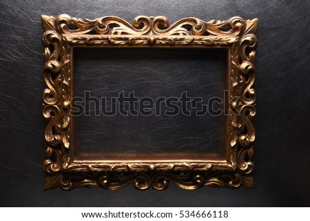 Old Antique Gold Wooden Frame on Grey Metal Background