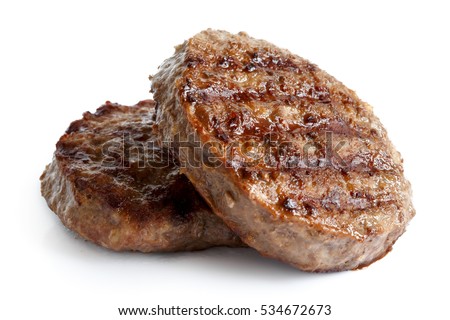 Two grilled hamburger patties isolated on white.