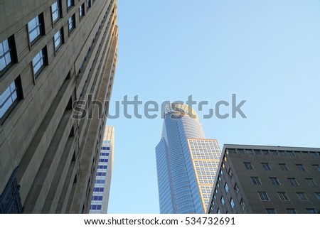 Look up view at downtown Minneapolis Minnesota skyscrapers. Center location for banking institution headquarters in north midwest at sunset