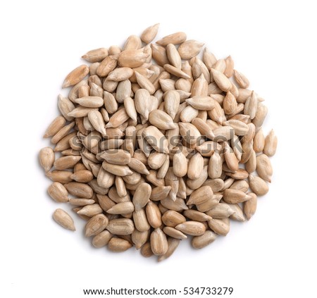 Top view of sunflower seeds isolated on white Royalty-Free Stock Photo #534733279