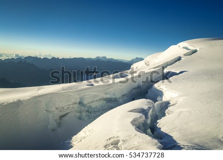 Photo of deep white snow and view from top of Huayna Potosi, mountain in Bolivia, South America.