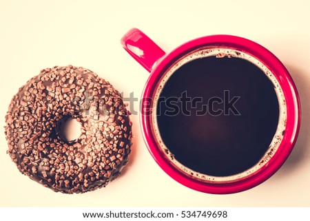 Donut. Sweet food and cup of coffee, tea drink. Breakfast, dessert with cake, snack. Brown wooden table. Bakery, sugar doughnut. Tasty espresso black hot morning beverage.