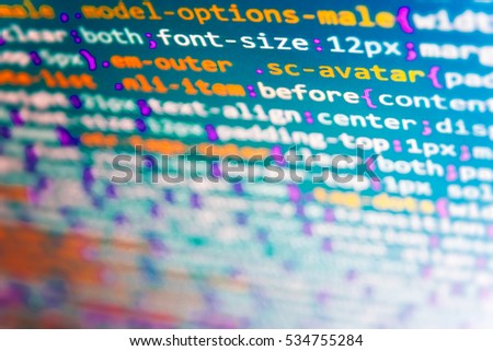 Source code close-up. Mobile app developer. Computer script typing work.  Computer code data. Website programming code. Abstract IT technology background.  Programming code on computer screen. 
