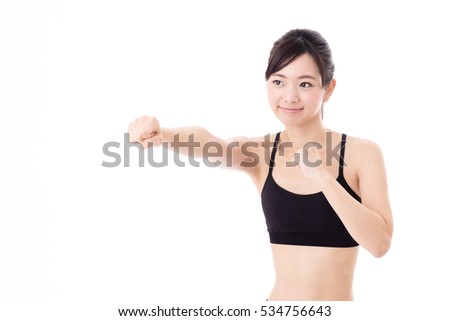 portrait of attractive sporty asian woman isolated on white background