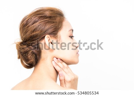 young beautiful woman massaging her neck