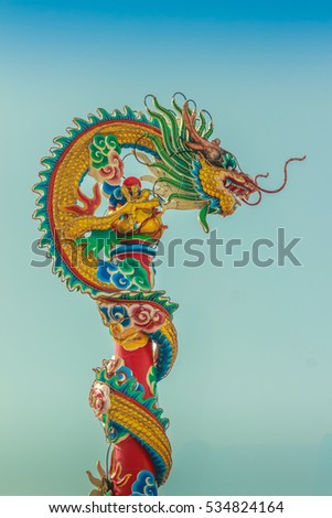 Beautiful Dragon Sculpture on the Chinese Pavilion Roof in the Chinese Temple