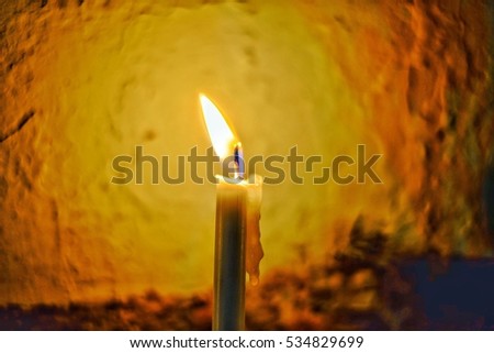 The light of candle reflect to dramatic emotional. natural light is used in this picture. blurred background.