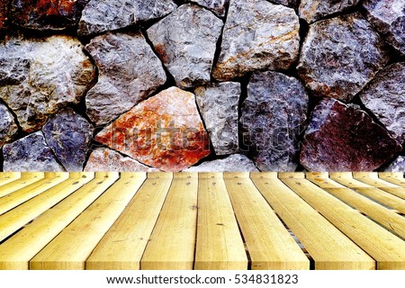 empty bamboo table with stone panel background. 