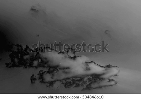 Black clouds on a dark background