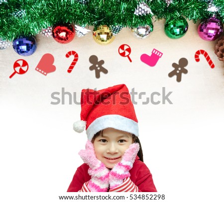 Adorable girl and red hat with decorations.Little girl in christmas hat for new year and christmas concept.