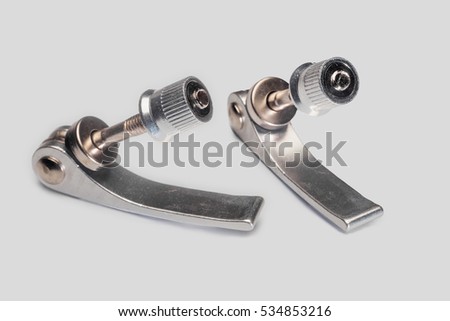 Two tightening  bolts for bicycle seat on a white background. Macro.