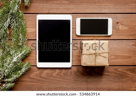 smartphone, tablet, shopping for new year online wooden table