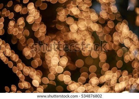 Color Blurred background : Bokeh lighting in city night light blur , defocused background, abstract Golden Bokeh circles for Christmas background
