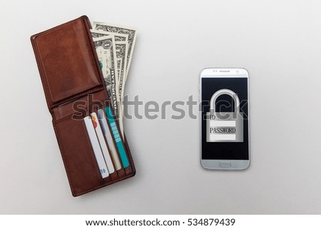 concept is smart phone security for money and finance, dollar and credit card, smart phone on white backgrounds