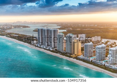 Miami Beach skyscapers and downtown skyline on background.