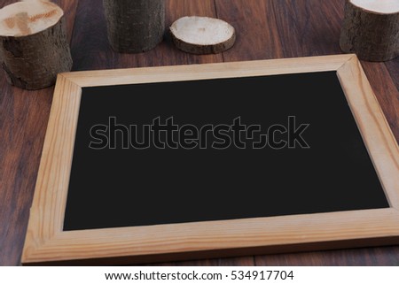 Ã�Â¡halk board frame on wooden table.