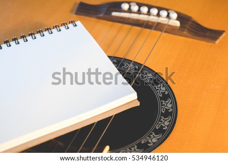 Concept of music, Notebook on guitar for writing music,Vintage retro picture style
