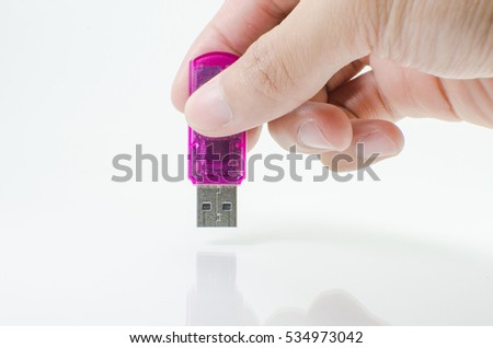 Hand holding Flash Drive
