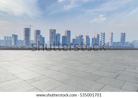 Panoramic skyline and buildings with empty concrete square floor Royalty-Free Stock Photo #535001701