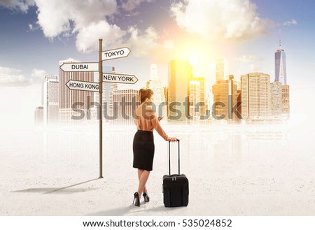 Rear view of a woman in a brown blouse with a luggage standing near a large city.  Concept of travelling to heaven. Mock up. Toned image