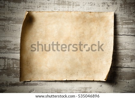 antique blank parchment on aged wooden wall