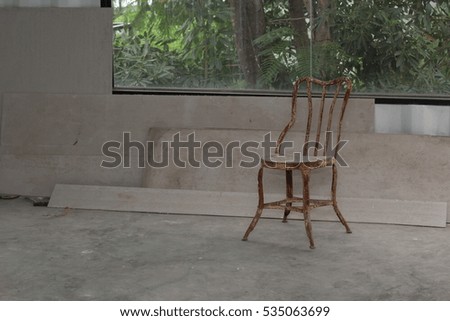 old rust chair in construction building
