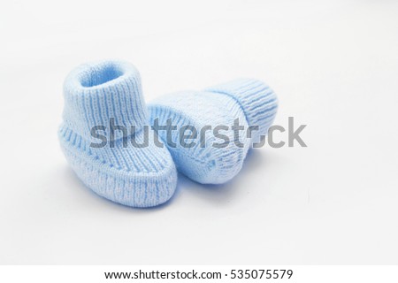 Waiting baby, baby shower. Blue newborn shoes Royalty-Free Stock Photo #535075579
