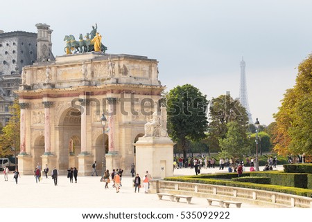 Arch Triumph Carousel with Eiffel tower on background. Triumphal arch in Paris, located in the Carrousel Square on the site of the former Tuileries Palace.