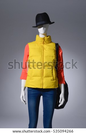 female in jeans with cap,bag on mannequin