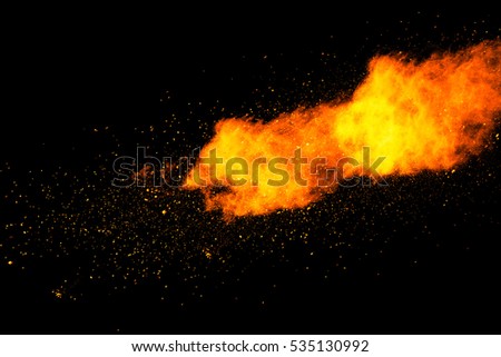 abstract powder splatted background,Freeze motion of colored powder exploding on black background.