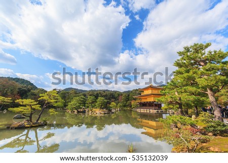Golden Pavilion Kinkakuji temple against blue sky background in autumn season at Kyoto, Japan