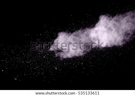 white powder explosion on black background.