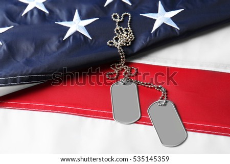 Army tokens on American national flag background