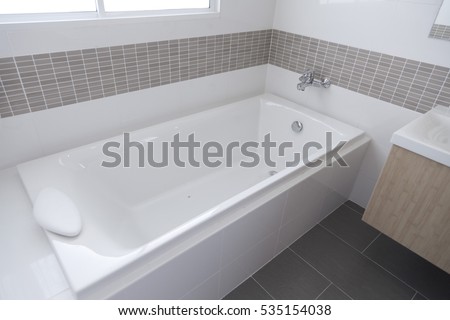 Detail of the bath tub in bathroom Royalty-Free Stock Photo #535154038